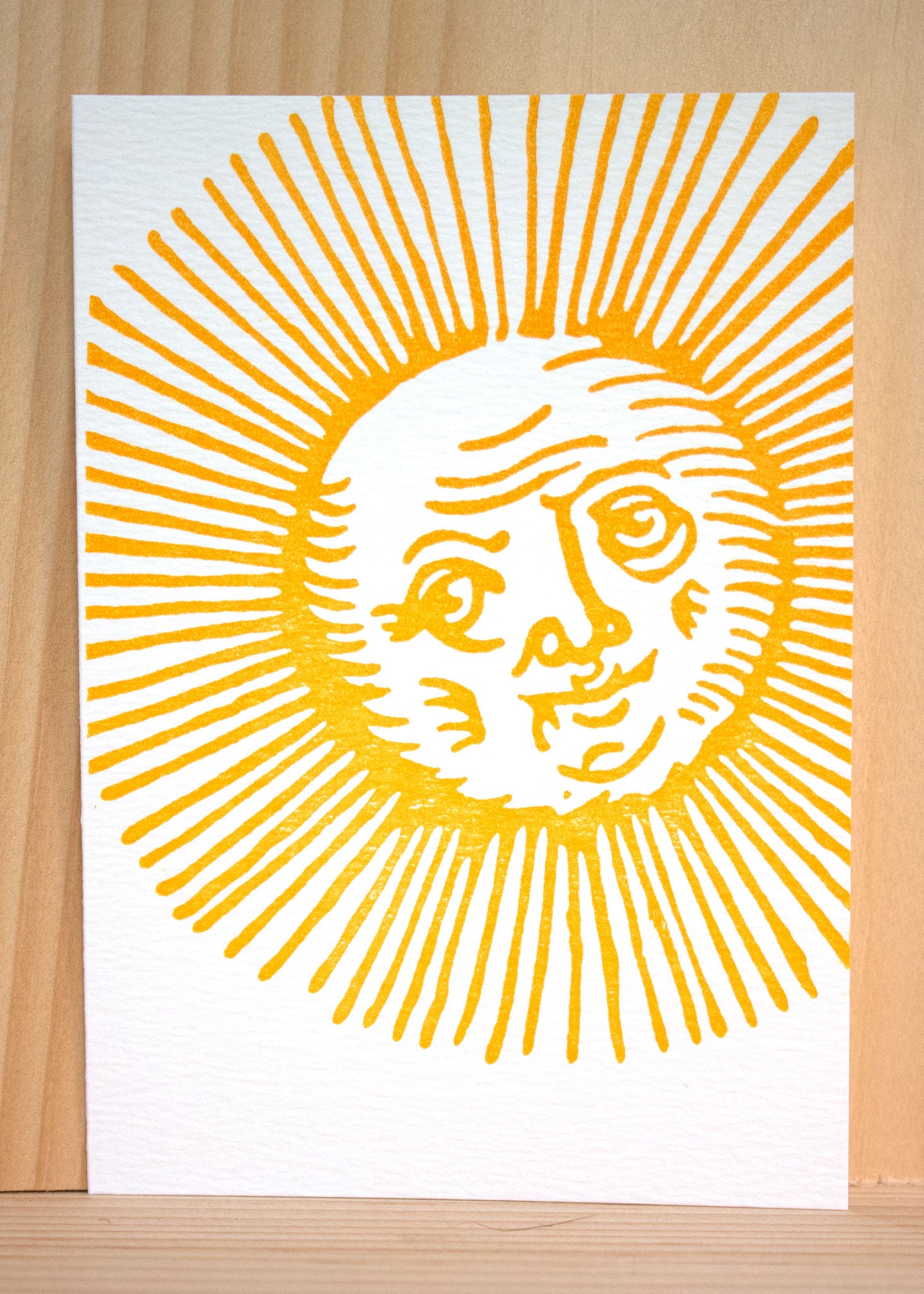 An illustration of an old sun,  depicting the 'old Sol' mythological character. The sun's rays are ornate and whimsical, evoking ancient depictions of solar symbols.