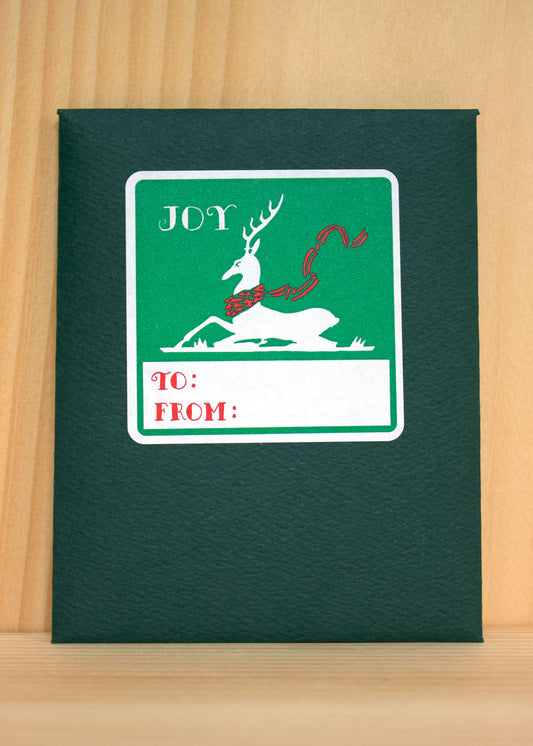 A graceful reindeer with antlers, symbolizing strength, endurance, and the joy of winter.