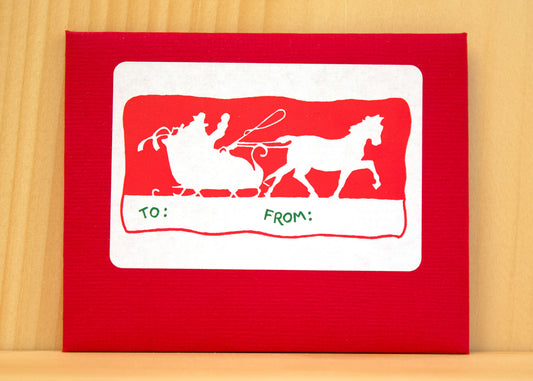 A horse-drawn sleigh moving through the snow, evoking nostalgic holiday memories and festive joy.